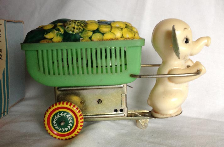 vintage boxed Chinese tinplate and plastic clock work wind up MS783 elephant Fruits Vender toy